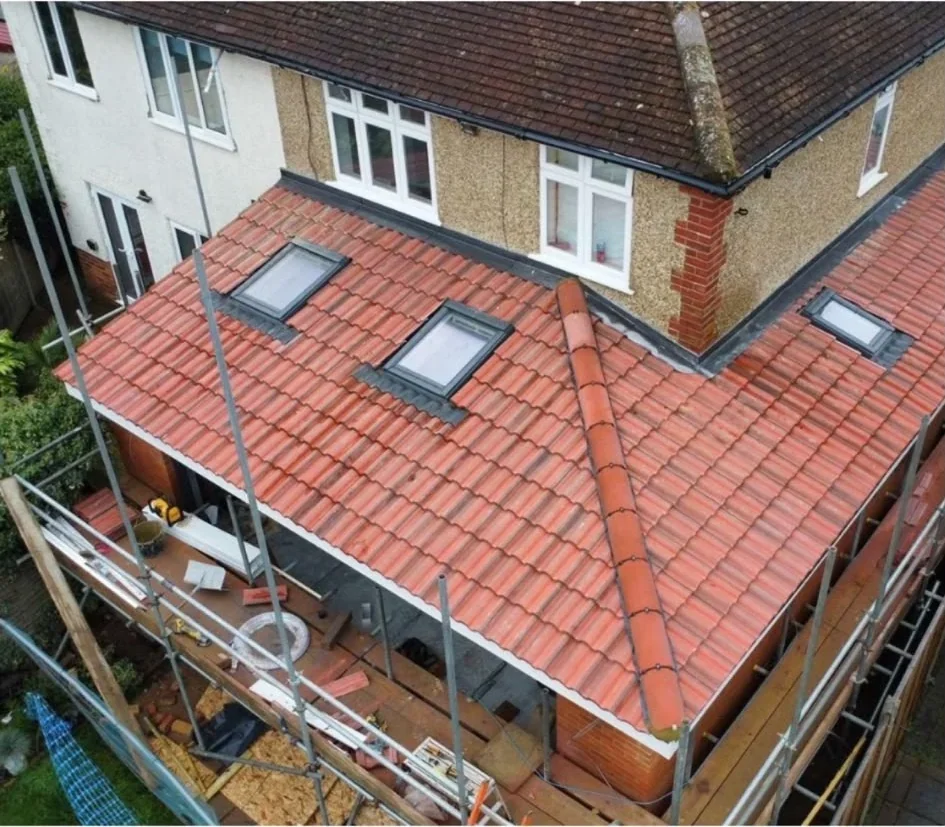New red tiled roof with rooflights on an extension