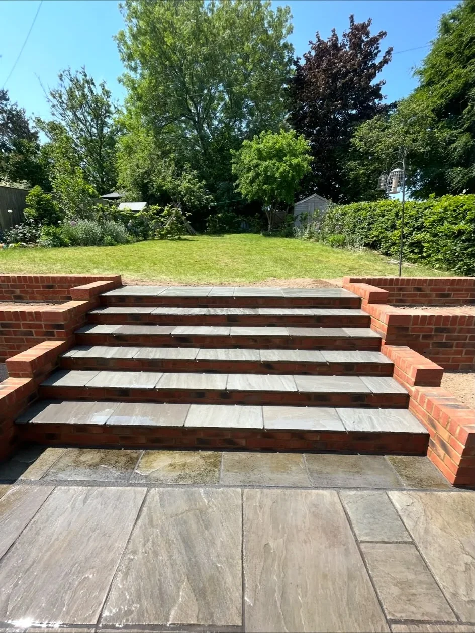 Precise red brick and stone garden steps